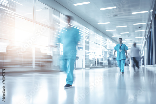 Doctors and nurses walk down bright modern hospital hall, medical background. Healthcare hospital clinic background.