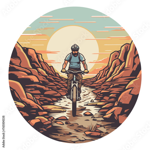 Mountain biker riding on the road in the desert.