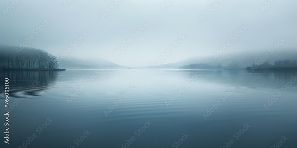 A calm lake with a boat floating on it