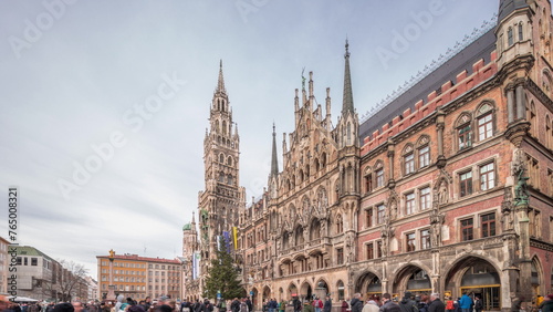Main facade of the New Town Hall building at the northern part of Marienplatz day to night transition in Munich, Germany. © neiezhmakov