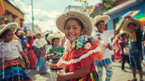 Smiling children dressed in colorful traditional Mexican outfits participate in a lively Cinco de Mayo street parade.