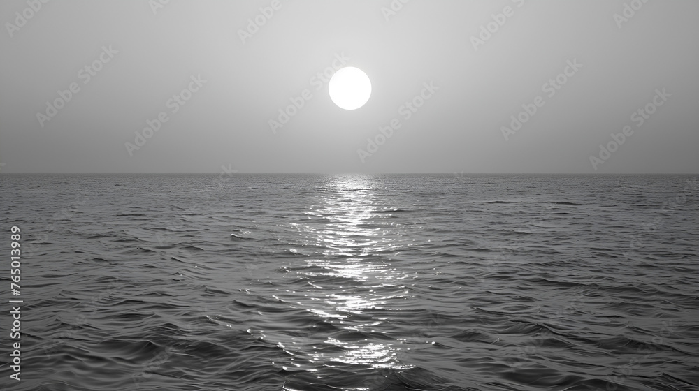 black and white water surface with ripples and sunlight reflections