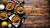 Fragrant curries on a cozy rustic background with a place for text