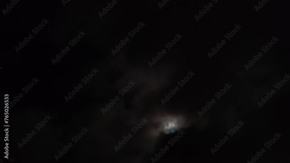 Altocumulus cloud can be seen in the sky thanks to the moonlight Altocumulus cloud can be seen in the sky thanks to the moonlight