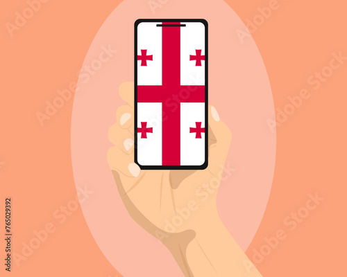Georgia flag on mobile phone screen, holding smartphone, advertising social media or banner concept