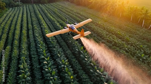 Aerial crop spraying in action, as a plane disperses treatment over a vast field