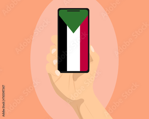 Sudan flag on mobile phone screen, holding smartphone, advertising social media or banner concept