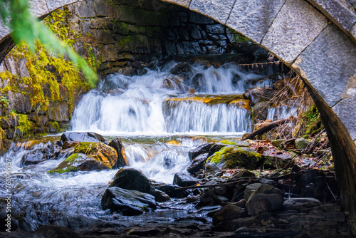 Fototapeta Naklejka Na Ścianę i Meble -  River stream in a small waterfall in mountains