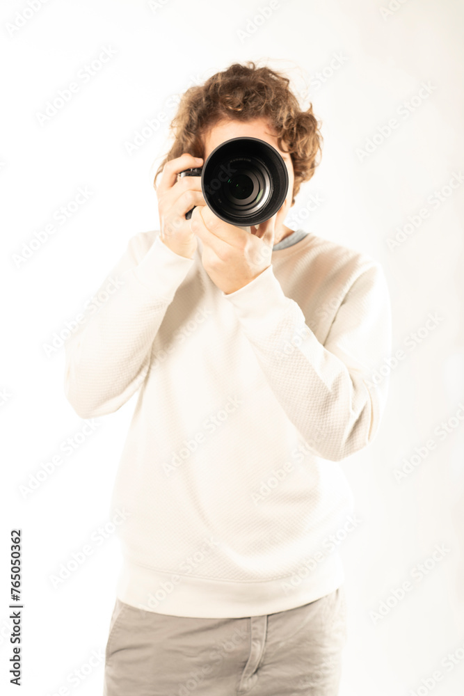 young photographer smiles while captured in high key lighting young photographer smiles while captured in high key lighting