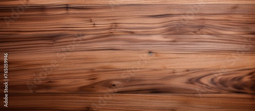 A detailed view of a wooden floor displaying a rich brown stain coloration