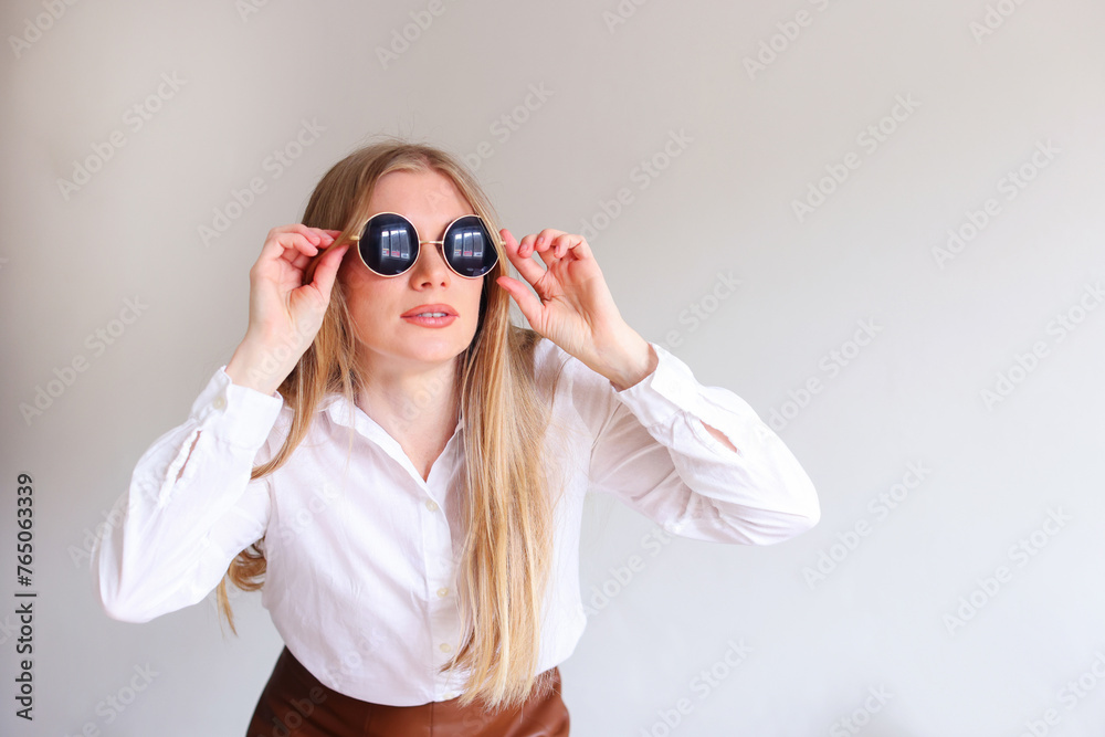 girl in black sunglasses on a white background, copy space for text girl in black sunglasses on a white background, copy space for text