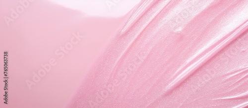 An up-close view of a pink plastic sheet against a plain white background photo