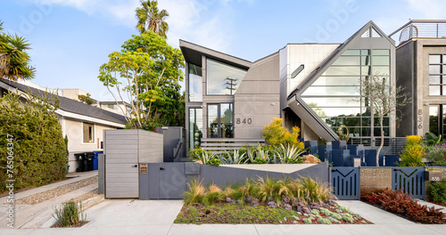 Beautiful modern house exterior with lush green plants in Venice Beach, California photo