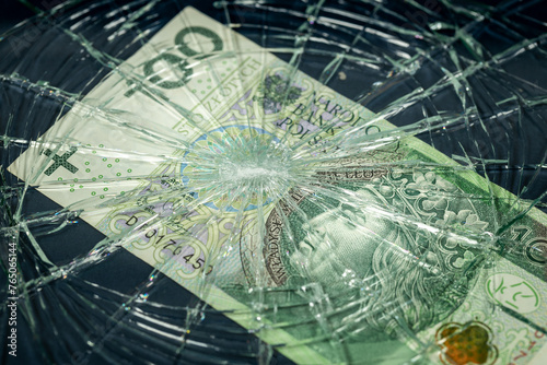 Obraz na płótnie Poland money, Fall of the Polish currency, Weakening of the Polish zloty 100 zloty banknote lying behind the broken window, Financial concept or insurance costs w salonie