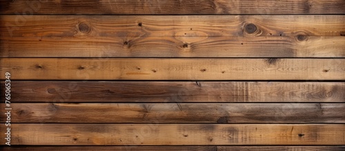 A detailed view of a wooden wall featuring numerous individual timber planks