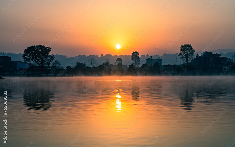 sunrise over the Taudah Lake in Kathmandu, Nepal.