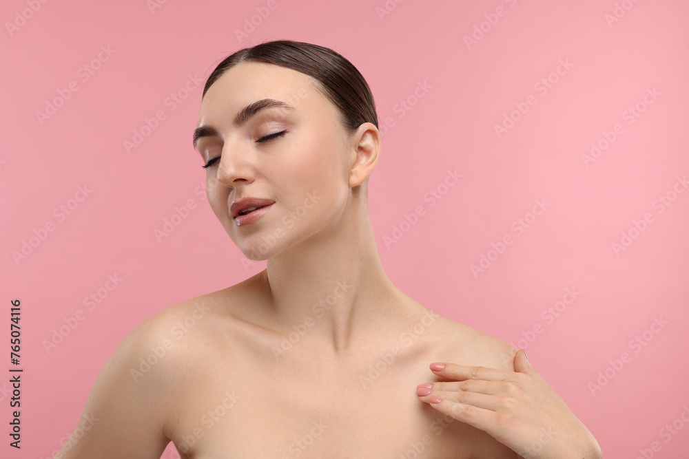 Obraz premium Portrait of beautiful woman on pink background