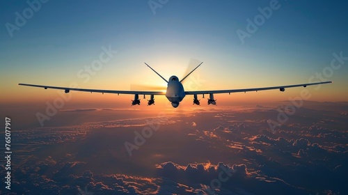The silhouette of an airplane captured from behind as it cruises at high altitude, with the sunrise painting a breathtaking backdrop.