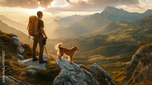 A hiker, a young man and his dog, hiking in beautiful rocky European Alps mountain landscape with a trekking backpack. A man hiking in the sunrise time.