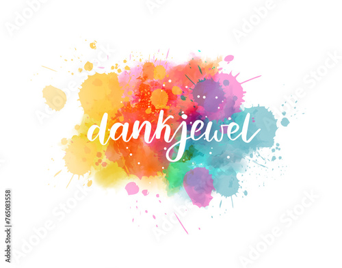 Dankjewel - Thank you in Dutch. Handwritten modern calligraphy watercolor lettering text. Colorful handlettering on watercolor paint splash