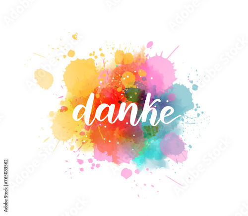 Danke - Thank you in German. Handwritten modern calligraphy watercolor lettering text. Colorful handlettering on watercolor paint splash
