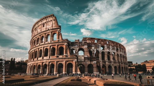Step into history s embrace. Our image captures the Colosseum s grandeur with bustling tourists and cozy accommodations in Rome s historic center