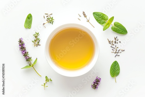 top view flat lay teacup filled with liquid surrounded by a variety of herbs and flowers on a white tableware, creating a picturesque scene of a calming tea time moment