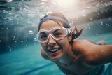 Woman Swimming in Pool With Goggles