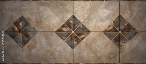 A textured wall adorned with a geometric pattern of squares and rectangles in various shades of brown and beige