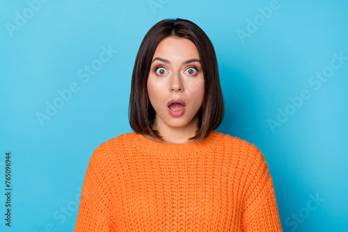 Portrait of attractive amazed girl sudden incredible news reaction wow isolated over bright blue color background