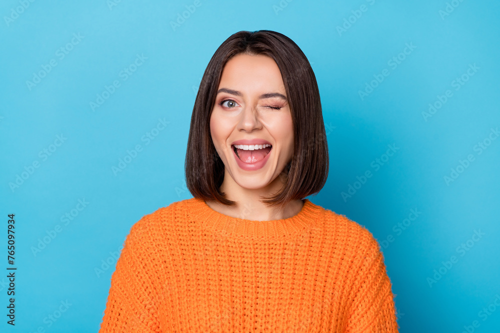 Portrait of attractive flirty cheerful girl winking good mood isolated over vibrant blue color background - obrazy, fototapety, plakaty 