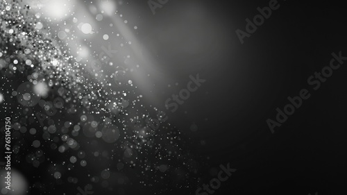 Abstract black and white bokeh lights effect - An artistic abstract background of light blurs and bokeh effects in grayscale, resembling a fantasy dust cloud
