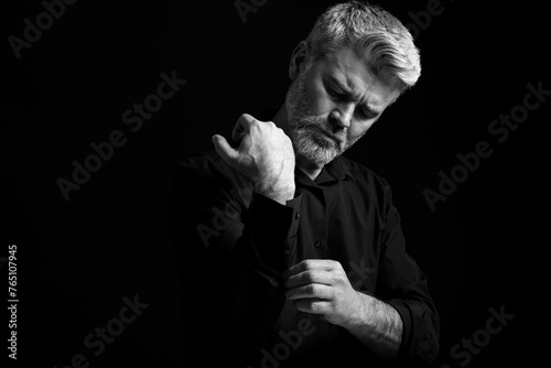 Portrait of handsome man on dark background. Black and white effect