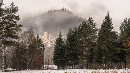 Aerial view of the mountains in the fog in the Poprad Landscape Park on a winter morning. photo