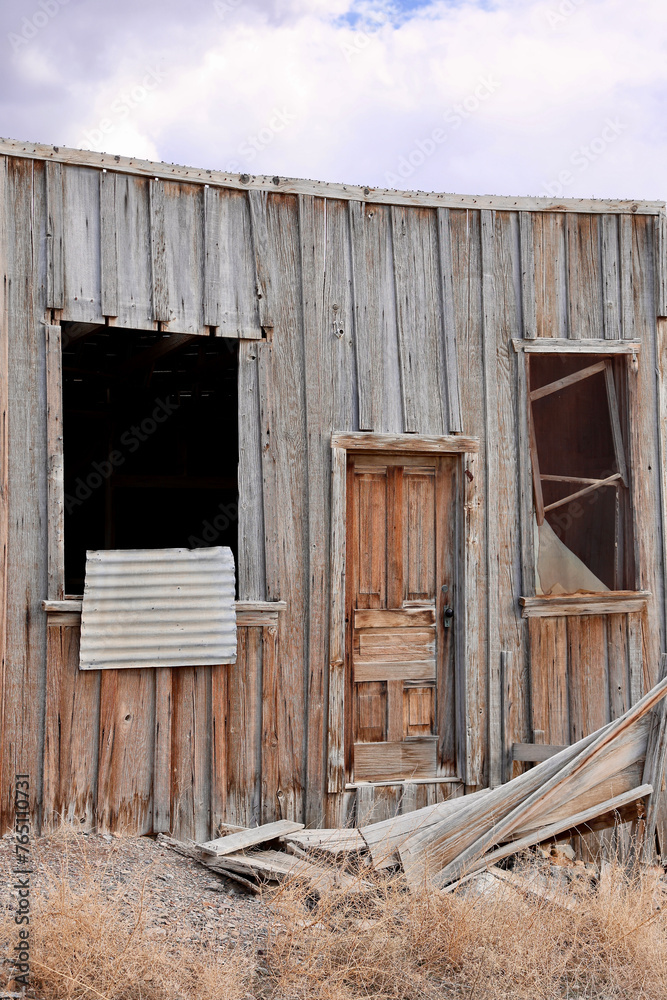 abandoned building with boarded up windows