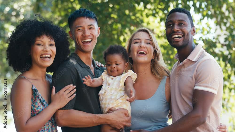 Portrait of couple visiting new family with baby daughter cuddling her in garden or countryside - shot in slow motion Portrait of couple visiting new family with baby daughter cuddling her in garden or countryside - shot in slow motion