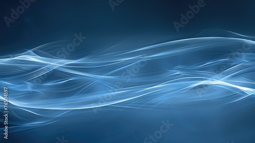 Abstract blue smoke on a dark background - Ethereal streams of blue smoke gently wafting across a dark and mysterious backdrop photo