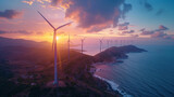 Wind turbines line a coastal landscape against a beautiful sunset sky, representing sustainable energy.