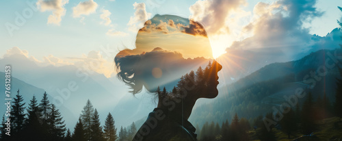 Woman's silhouette blended with sunset mountain vista