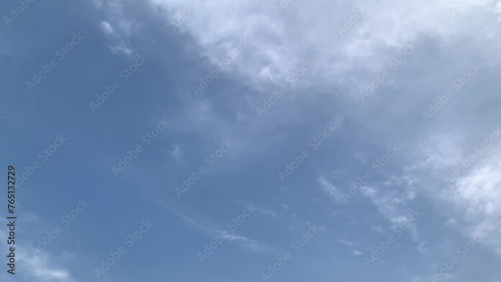 clouds passing through clouds with blue sky background