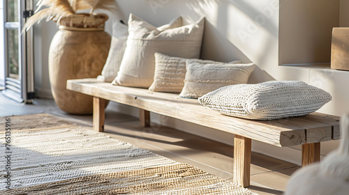 Benches in natural wood finishes, accompanied by woven throw pillows and a contemporary area rug