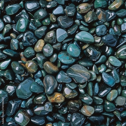 a close up of a bunch of rocks with different colors of rocks in the middle of the image and the top of the rocks in the middle of the picture.