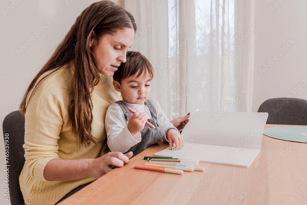 Mother and Child Engaged in Drawing Activity with Color Markers at Home Mother and Child Engaged in Drawing Activity with Color Markers at Home