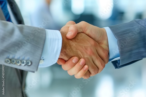 businessmen shaking hands . Handshake in close-up, in suits