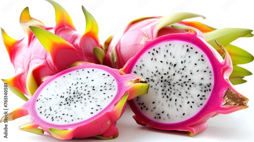 a dragon fruit cut in half sitting on top of a white table next to a cut in half dragon fruit. a dragon fruit cut in half sitting on top of a white table next to a cut in half dragon fruit.