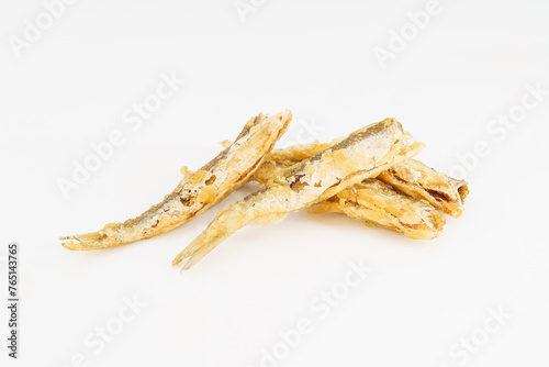 Fried small river fish on white background