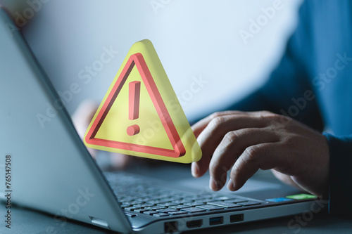 Business investment risks concept. Problem and error warning caution concept. Businessman holding warning sign on virtual screen for caution in investing economic situation warning.