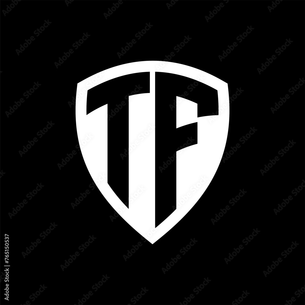 TF monogram logo with bold letters shield shape with black and white color design TF monogram logo with bold letters shield shape with black and white color design