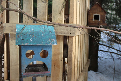 bird feeder in the form of a blue house