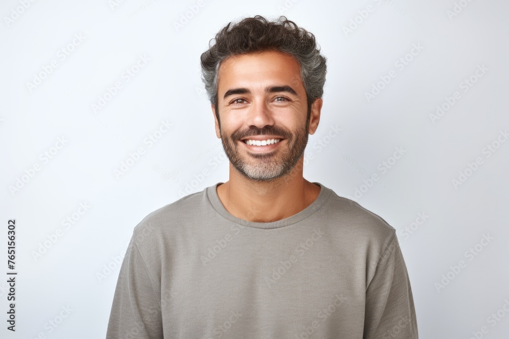 Portrait of a man with a beard smiling at the camera Portrait of a man with a beard smiling at the camera